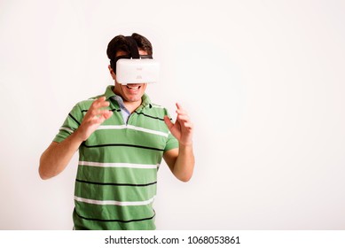 amazed guy using a virtual reality headset isolated on white background