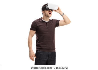 Amazed guy using a virtual reality headset isolated on white background