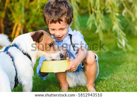 Similar – Image, Stock Photo Three boys take a run for the jump into the sea