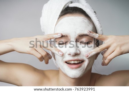 Amazed happy Woman use white cleanser mack,scrub on face