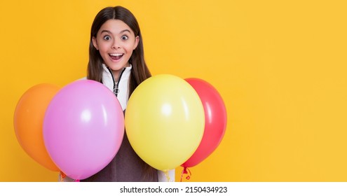 Amazed Kid With Party Colorful Balloons On Yellow Background