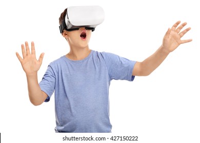 Amazed Little Boy Looking In A VR Goggles And Gesturing With His Hands Isolated On White Background