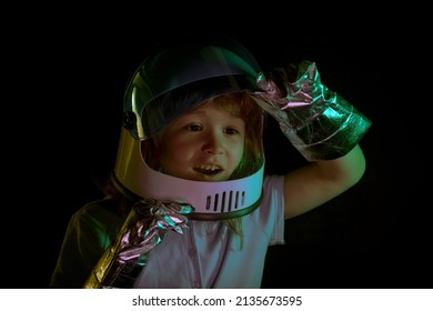 Amazed Little Boy Playing To Be An Astronaut With Space Helmet And Metal Suit. Close Up Excited Kids Face.