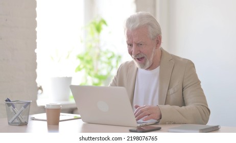 Amazed Old Man Excited For Success While Using Laptop