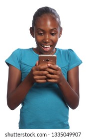 Amazed Reaction Reading Text Message By Primary School Aged Young Black Girl Holding Her Mobile Phone Wearing Blue Shirt Against White Background