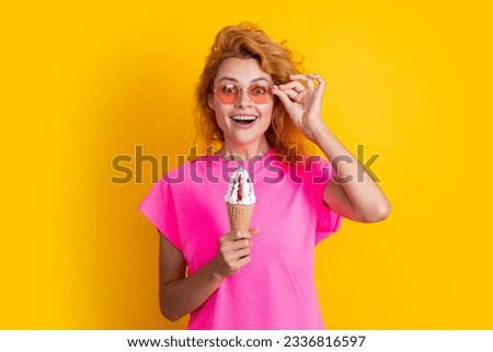 amazed summer woman with cone icecream isolated on yellow. summer woman