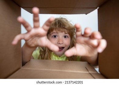 Amazed Surprised Shocked Little Boy Peeking Inside Gift Box, Unpacking Present With Funny Astonished Expression, Impatient Child Unboxing Surprise. Children Expression Surprised Face.