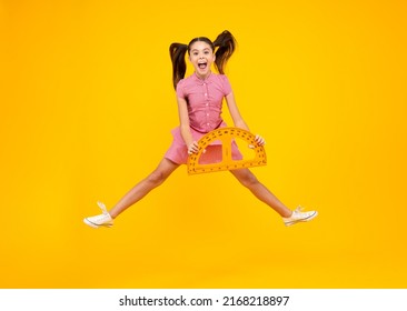 Amazed Teenager. Back To School. Teenager School Girl On Isolated Background. Crazy Jump, Jumping Kids. Excited Teen Schoolgirl With School Supplies.