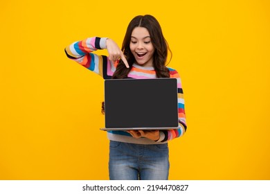 Amazed Teenager. Teenager School Girl Hold Notebook Laptop. Screen Of Laptop Computer With Copyspace Mockup. School Children On Isolated Studio Background. Excited Teen Schoolgirl.