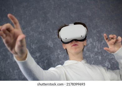 Amazed Teenager Using VR Headset. Teen Man Play Vr Video Game. Digital Future And Innovation. Virtual Goggles. Excited Teen Man With Virtual Reality Goggles Headset.