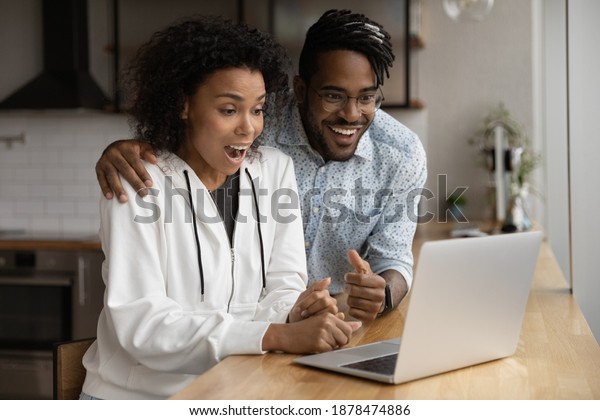 Amazed Young Biracial Couple Look Laptop Stock Photo 1878474886 ...