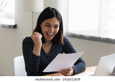 Amazed Young Mixed Race Female Student Hold Official Written Letter With Good Test Exam Results. Happy Asian Woman Look At Paper Document Celebrate Admission To University Receive Grant Scholarship