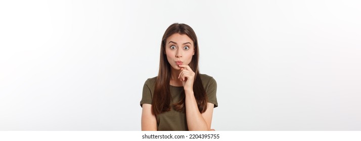 amazement - woman excited looking to the side. Surprised happy young woman looking sideways in excitement. Mixed race Asian and white Caucasian female model on grey background. - Shutterstock ID 2204395755