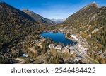 Amazing aerial autumn drone view of mountains, lake and village at Champex-Lac in the Swiss Alps in the Canton of Valais