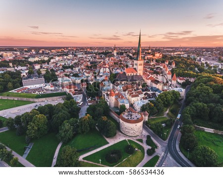 Amazing aerial drone shot of old town of Tallinn, Estonia at sunset