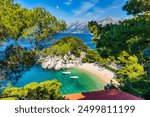 Amazing aerial view of the beautiful Podrace beach in Brela, Makarska Riviera, Croatia. Aerial view of Podrace beach and waterfront on Makarska riviera, Brela, Dalmatia region of Croatia.