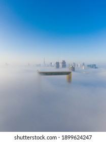 Amazing Aerial View Of Dubai Frame And City Skyline Covered In Dense Fog In Winter Season