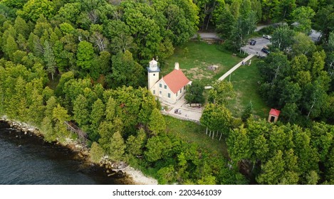 Amazing Aerial View Of A Light House On The Shore Of Lake Michigan In Fish Creek Wisconsin