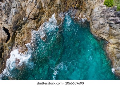 Amazing Aerial view of sea waves hitting rocks with turquoise sea water Beautiful seascape in the Phuket island coastline Top view sea surface - Powered by Shutterstock