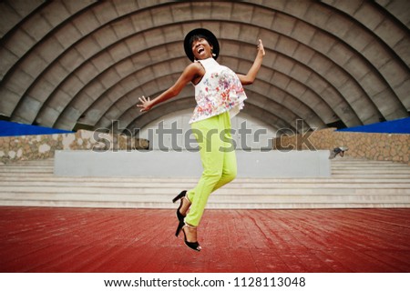 Similar – Happy women jumping in front of garden fence