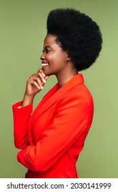 Amazing african american woman smiling. Profile of successful black businesswoman in red suit happy excited touch chin. Proud ethnic female, entrepreneur business lady listen to project presentation