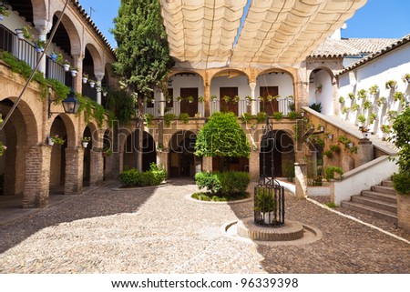 Similar – Image, Stock Photo A Mediterranean courtyard, the curved facade of a residential building and a delicate flower