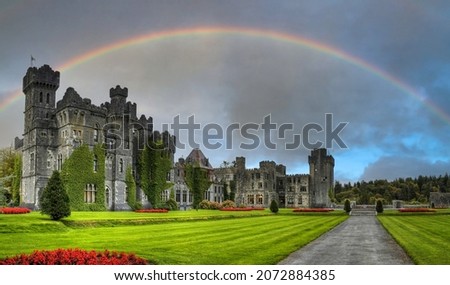 Amazing architecture of the Ashford castle in Co. Mayo with a rainbow, Ireland