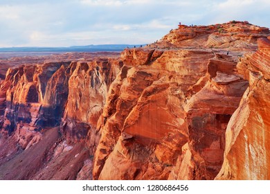 Amazing Arizona Landscape. Spring Break Travel Concept. Rays Of Setting Sun Illuminated Red Sandstone Canyon. Horseshoe Bend Of Colorado River During Sunset Hours, Arizona, USA.