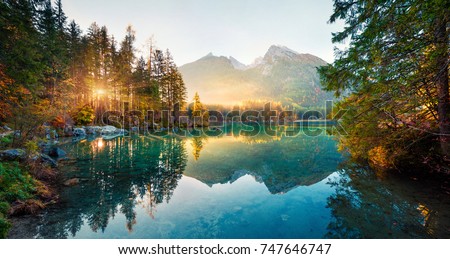Amazing autumn sunrise of Hintersee lake. Picturesque morning view of Bavarian Alps on the Austrian border, Germany, Europe. Beauty of nature concept background.