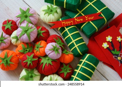 Amazing background on Tet holiday in Vietnam, banh tet, banh chung or glutinous rice cake make handmade from colorful material, harmony concept with Happy New Year message, traditional Lunar New Year