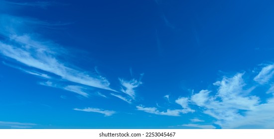 Amazing Beautiful white fluffy clouds on a bright blue sky background.clear sky cloudy background.select focus. - Shutterstock ID 2253045467