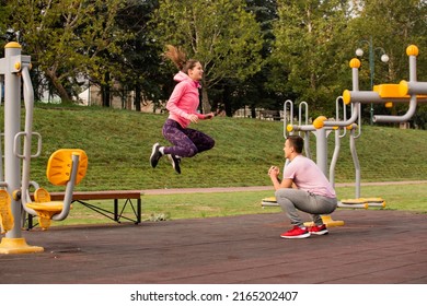 Amazing and beautiufl couple is doing some jumping exercise together