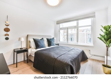 Amazing Bedroom With A Soft Bed And Wooden Floor