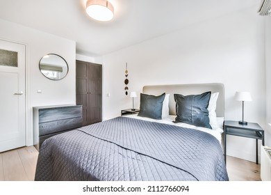 Amazing Bedroom With A Soft Bed And Wooden Floor