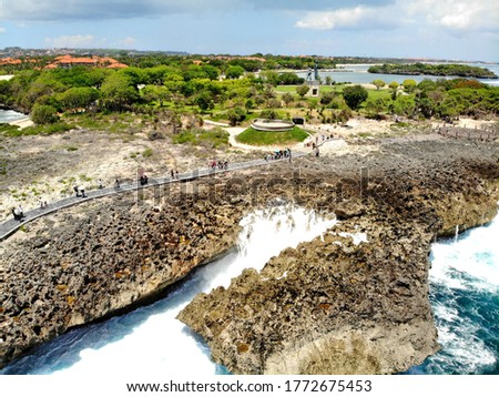 An amazing bird flight view on the Water Blow Nusa Dua. Tourist attraction has a natural phenomenon with waves crashing, towering up to 8 meters slammed in the reefs. Bali, Indonesia.