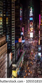 Amazing Bird's Eye View Of Times Square, New York City At Night Showing All The Car Traffic And Pedestrian Activity In The Center Of The World. 