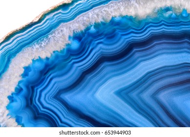 Amazing Blue Agate Crystal cross section isolated on white background. Natural translucent agate crystal surface, Blue abstract structure slice mineral stone macro closeup