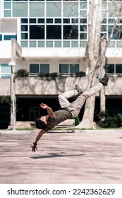 Amazing break dance dancer practicing in the park and showing his talent.