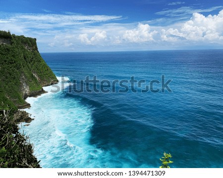 Similar – Sea waves breaking against cliff