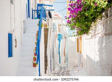 Amazing colorful stairs on beautiful narrow streets of greek island with balconies and white houses. Beautiful architecture building exterior with cycladic style. - Powered by Shutterstock