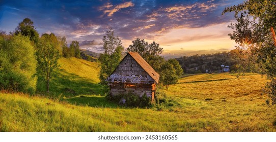 Amazing countryside landscape of romanian village Rogojel with forested hills and grassy meadows in mountains. Location: Rogojel, Cluj County, Romania, Europe
