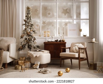 Amazing and cozy christmas living room interior with shelf, boucle armchair, pouf, mock up poster, christmas tree, gifts, decoration, lights, big window and elegant accessories. Family time. Template.