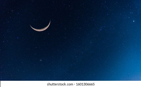 Amazing Crescent Moon On Dark Blue Night Sky Background.Universe Filled With Stars, Nebula And Galaxy With Noise And Grain.selection Focus.