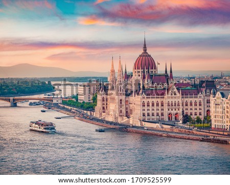 Amazing evening view of Parliament house. Stunning spring cityscape of Budapest. Great sunset in Hungary, Europe. Traveling concept background.
