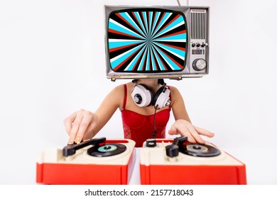 Amazing female dj with a television as a head. On the screen is spiral hypnotic pattern,