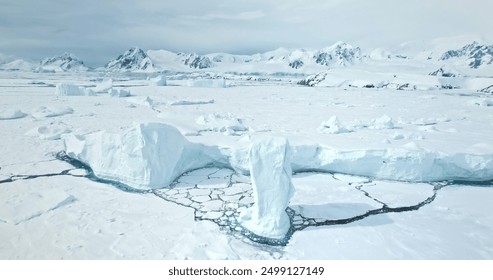 Amazing frozen arctic polar nature landscape. Snow covered icebergs, glacier and mountain range. towering ocean cost bay. Polar cold landscape. Antarctic travel and exploration. Aerial drone flight - Powered by Shutterstock