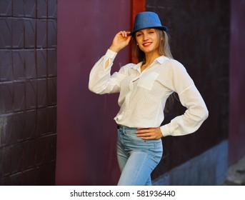 Amazing girl smiling in blue hat