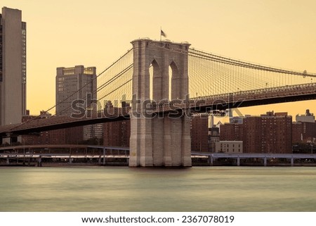 Similar – Image, Stock Photo Brooklyn Bridge over river against city in evening