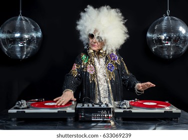 An Amazing Grandma DJ, Older Lady Djing And Partying In A Disco Setting