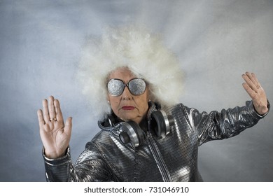 An Amazing Grandma DJ, Older Lady With Headphones, Partying In A Disco Setting